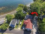 Red arrow points to cottage - Aerial views